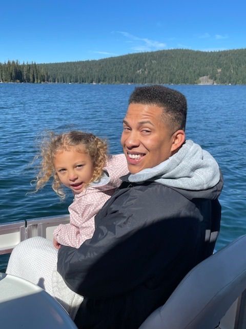 Aaron Wiley and his daughter on the lake