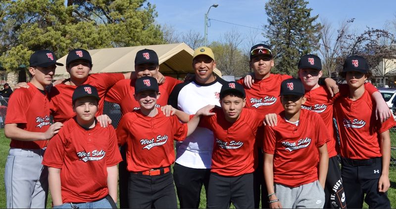 Aaron coaching West Side youth baseball team